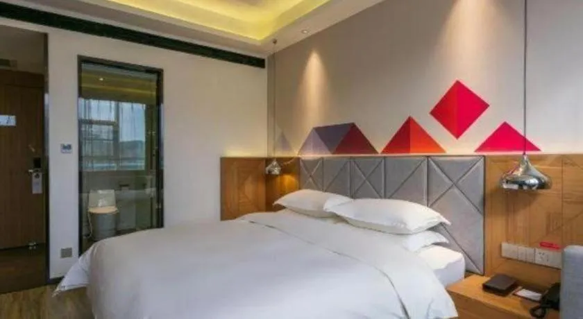 Bed in Borrman Hotel Hechi Bama Central Cultural Plaza