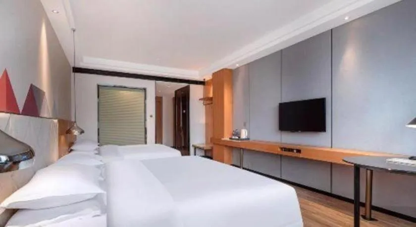 Bed in Borrman Hotel Hechi Bama Central Cultural Plaza