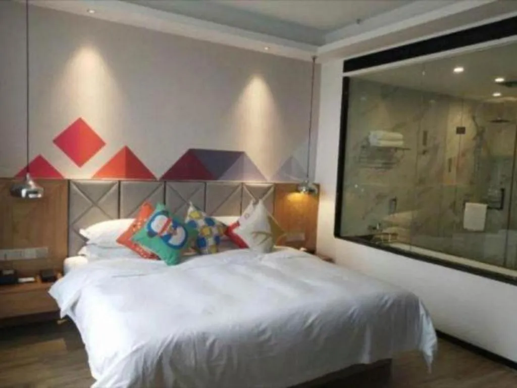 Bed in Borrman Hotel Hechi Bama Central Cultural Plaza