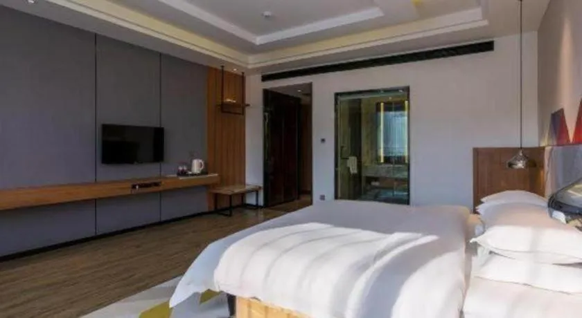 Bed in Borrman Hotel Hechi Bama Central Cultural Plaza