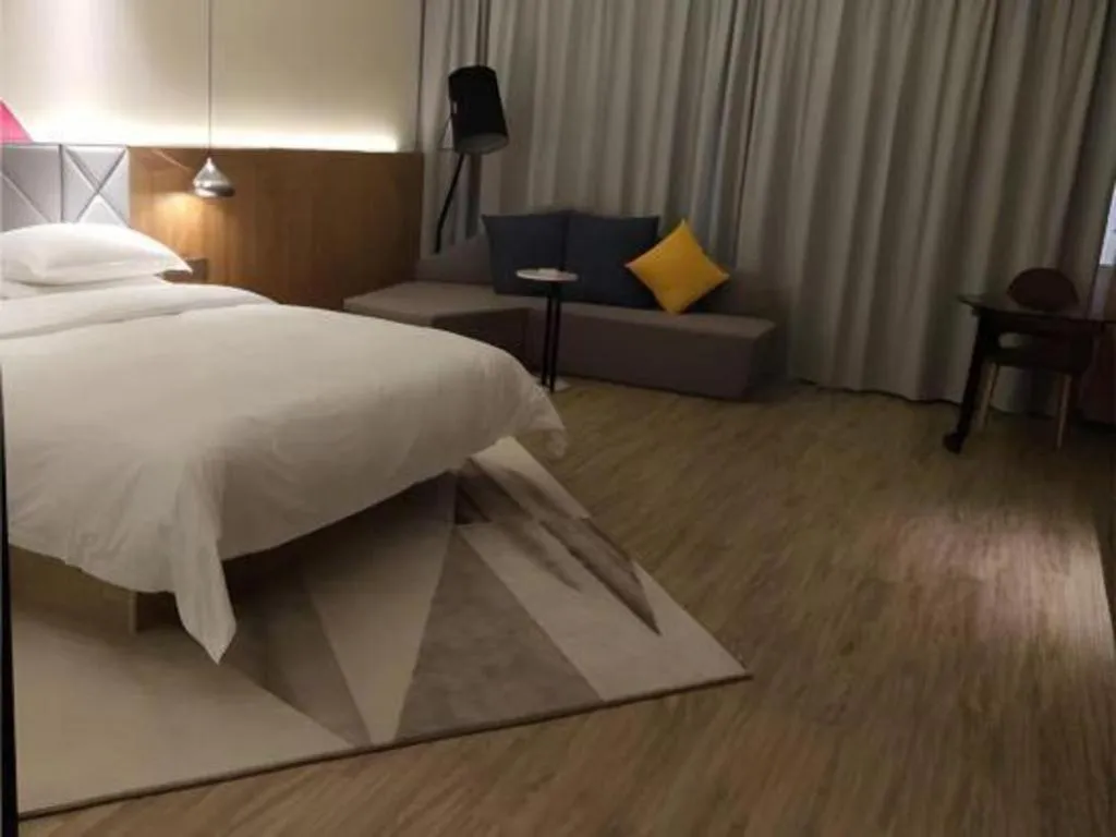 Bed in Borrman Hotel Hechi Bama Central Cultural Plaza