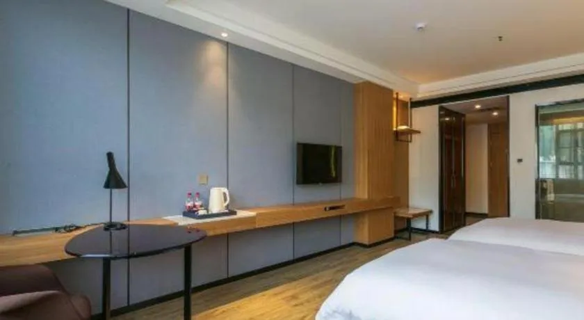 Bed in Borrman Hotel Hechi Bama Central Cultural Plaza