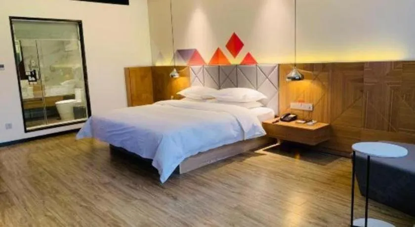 Bed in Borrman Hotel Hechi Bama Central Cultural Plaza