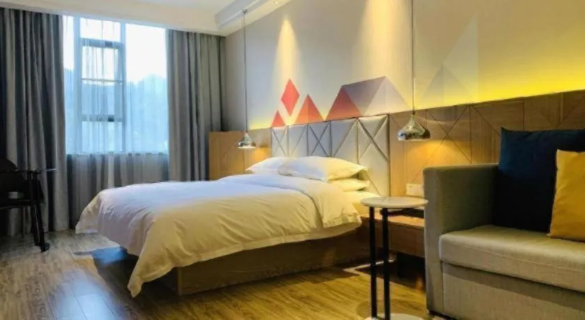 Bed in Borrman Hotel Hechi Bama Central Cultural Plaza