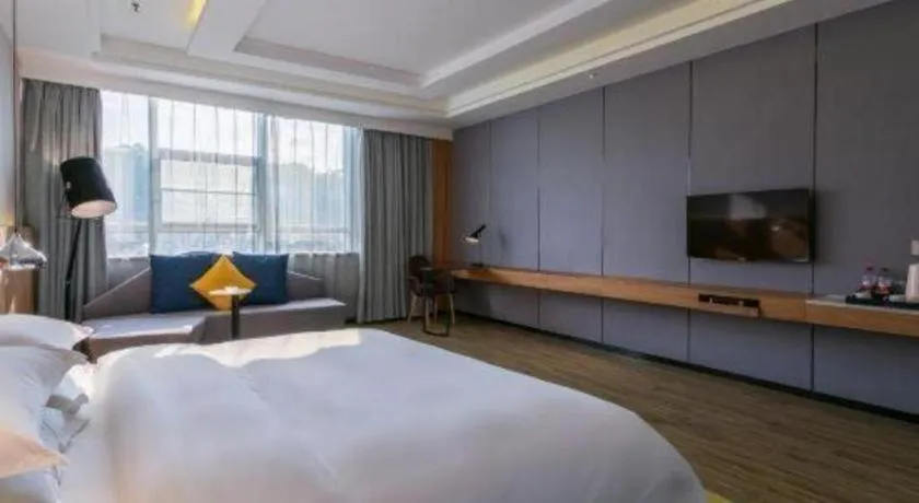 Bed in Borrman Hotel Hechi Bama Central Cultural Plaza