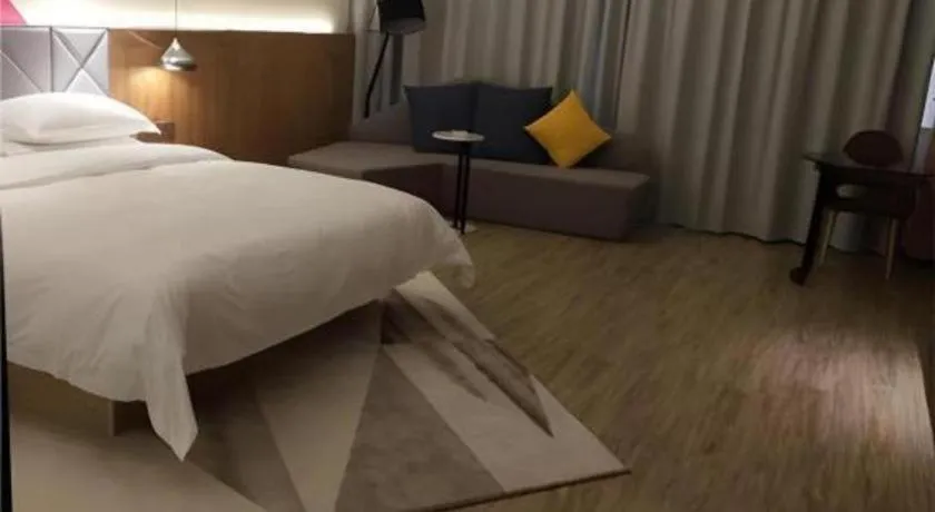 Bed in Borrman Hotel Hechi Bama Central Cultural Plaza