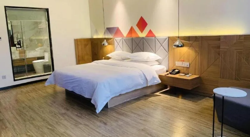 Bed in Borrman Hotel Hechi Bama Central Cultural Plaza