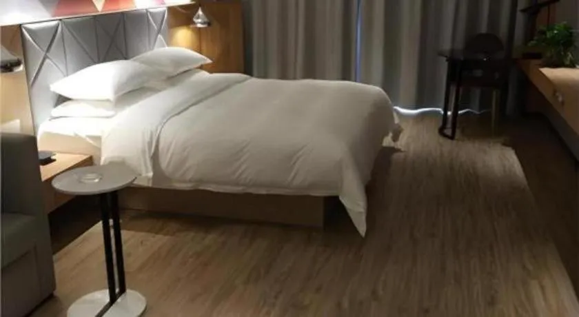 Bed in Borrman Hotel Hechi Bama Central Cultural Plaza