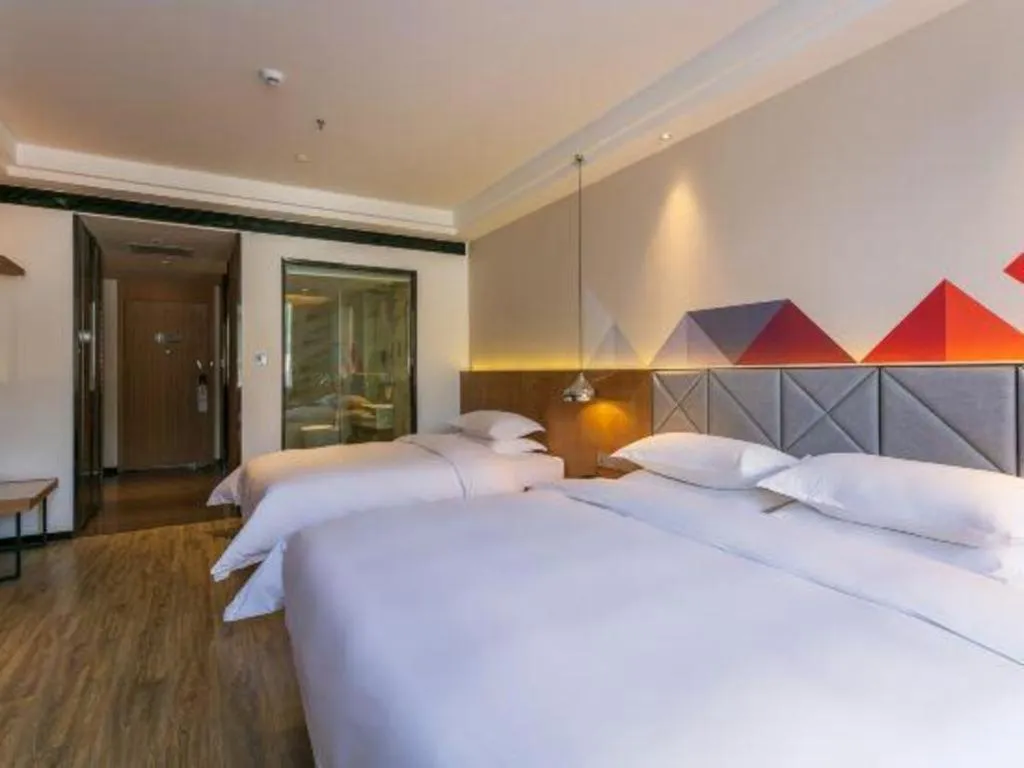 Bed in Borrman Hotel Hechi Bama Central Cultural Plaza