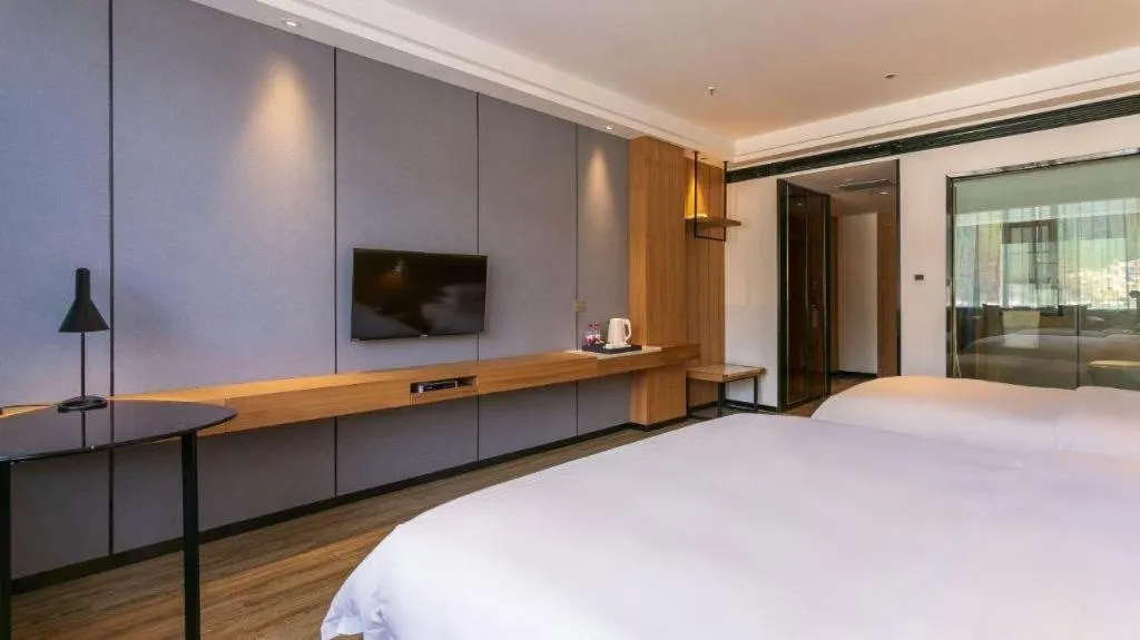 Bed in Borrman Hotel Hechi Bama Central Cultural Plaza