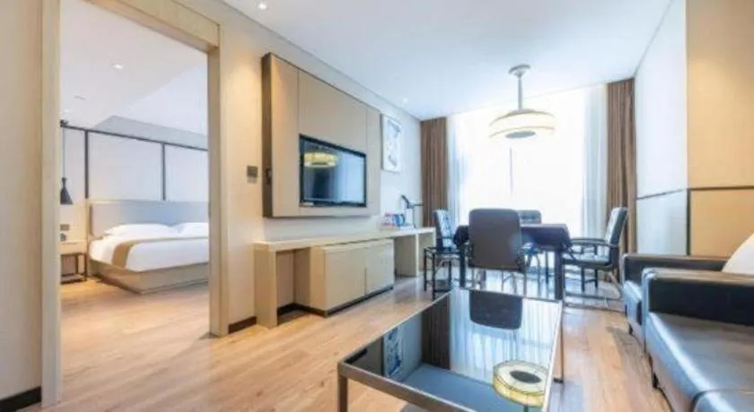 Bed in Echarm Hotel Xiantao Yuantai Weilaicheng