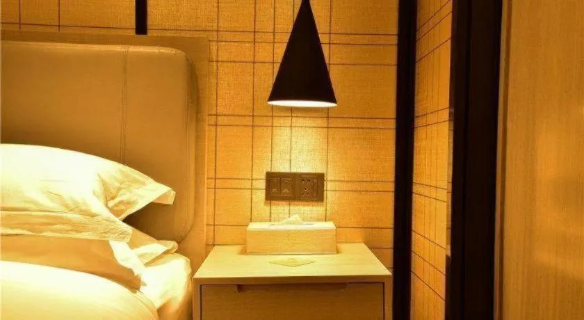 Bed in Echarm Hotel Xiantao Yuantai Weilaicheng