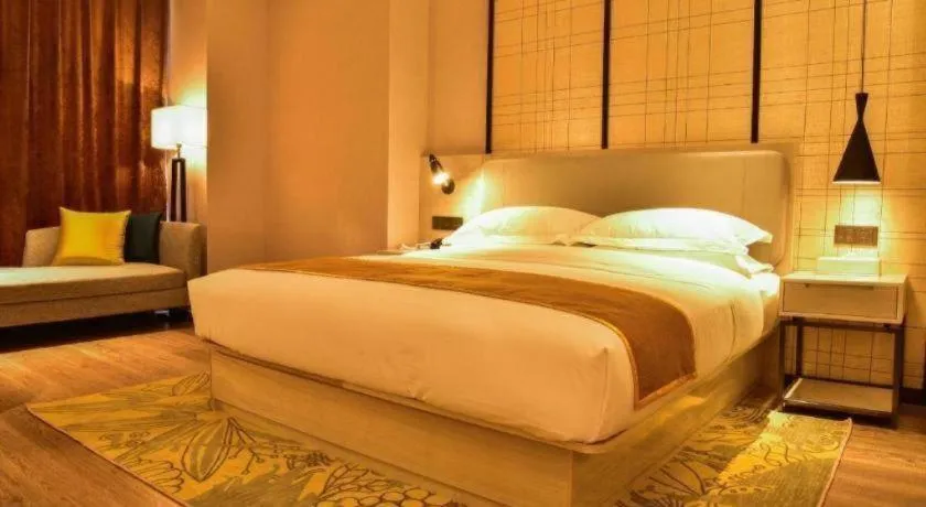 Bed in Echarm Hotel Xiantao Yuantai Weilaicheng