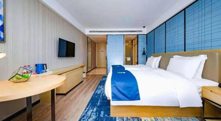 Bed in Echarm Hotel Xiantao Yuantai Weilaicheng