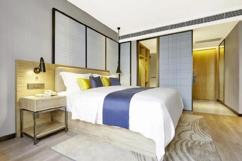 Bed in Echarm Hotel Xiantao Yuantai Weilaicheng