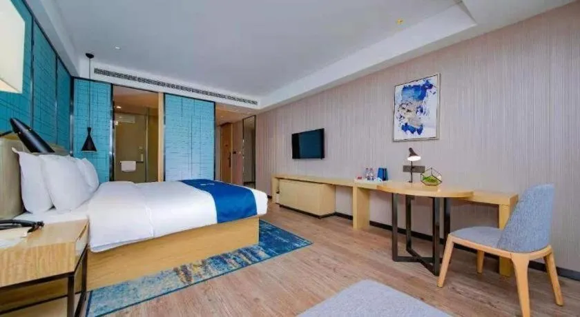 Bed in Echarm Hotel Xiantao Yuantai Weilaicheng