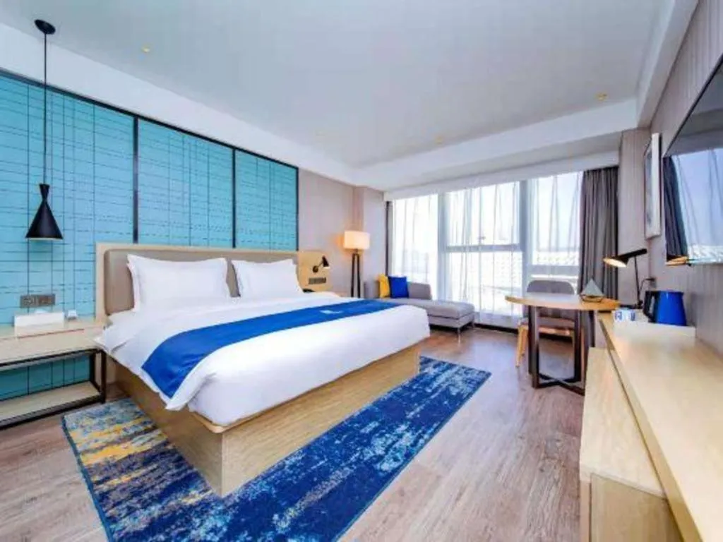 Bed in Echarm Hotel Xiantao Yuantai Weilaicheng