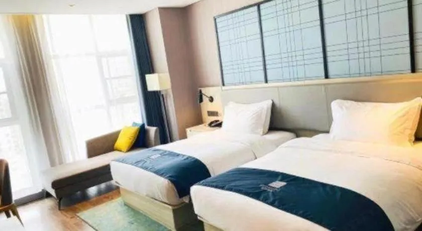 Bed in Echarm Hotel Xiantao Yuantai Weilaicheng