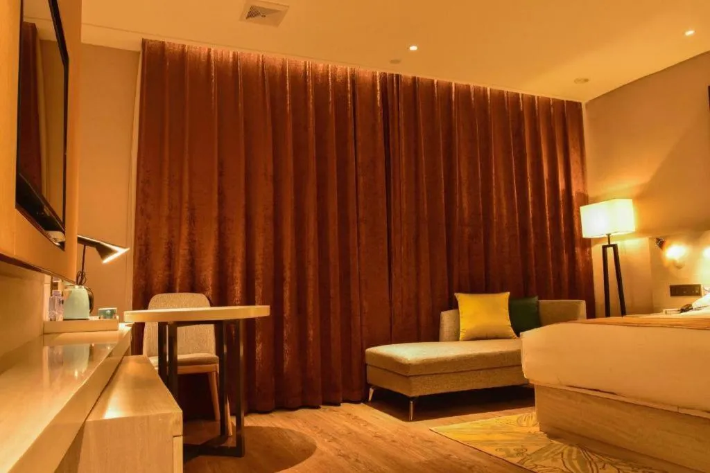 Bed in Echarm Hotel Xiantao Yuantai Weilaicheng