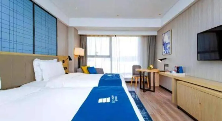 Bed in Echarm Hotel Xiantao Yuantai Weilaicheng