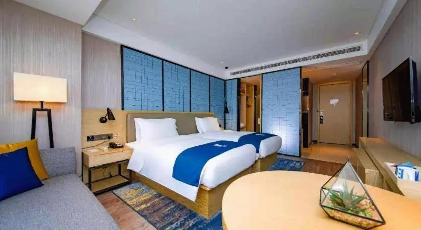 Bed in Echarm Hotel Xiantao Yuantai Weilaicheng