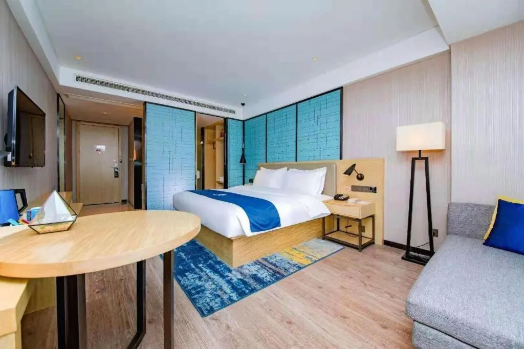 Bed in Echarm Hotel Xiantao Yuantai Weilaicheng