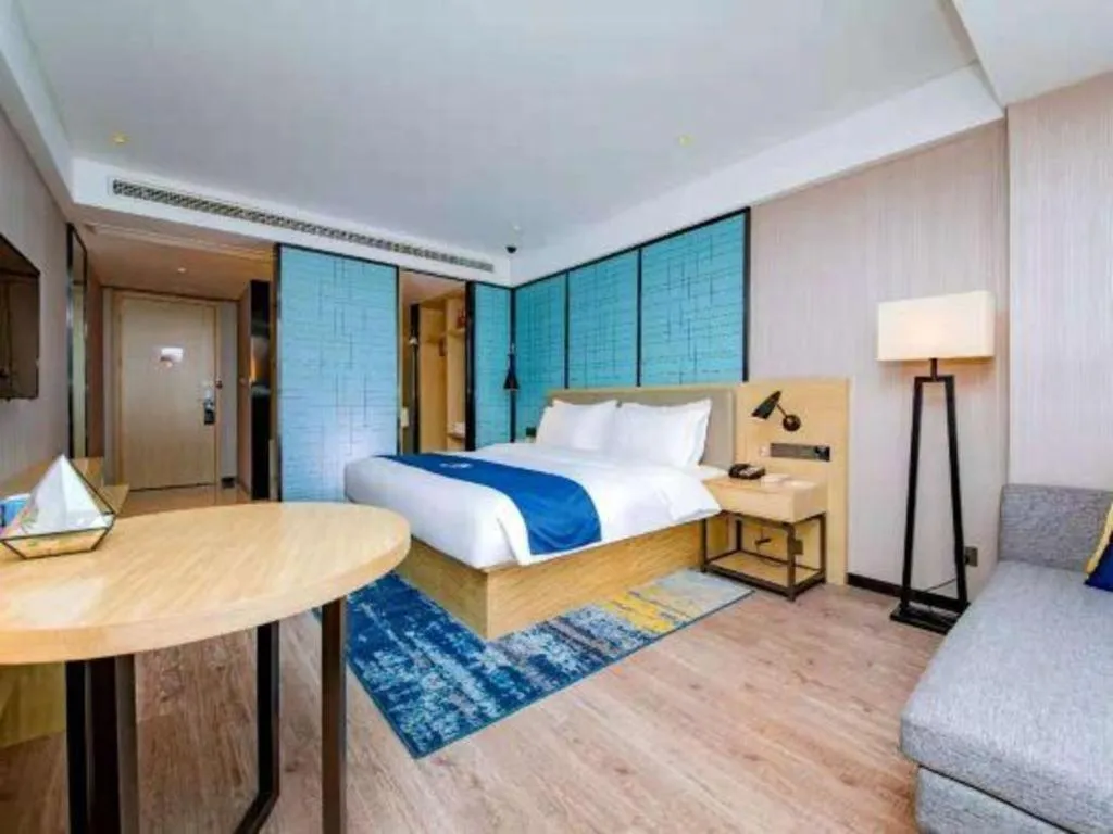 Bed in Echarm Hotel Xiantao Yuantai Weilaicheng