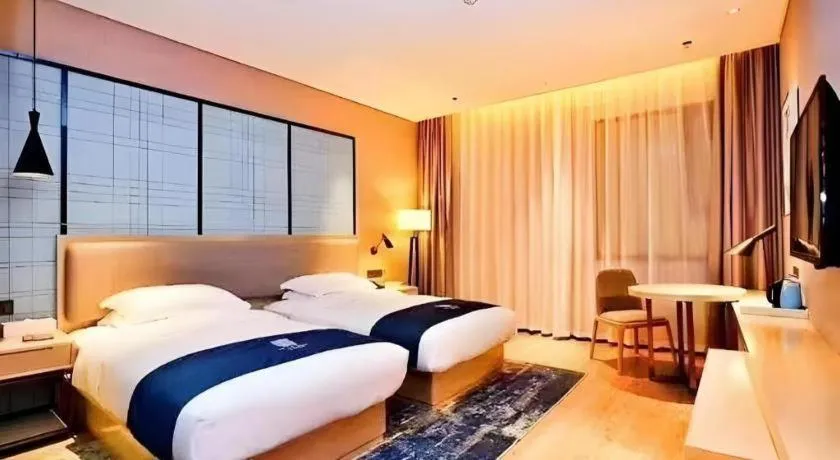 Bed in Echarm Hotel Xiantao Yuantai Weilaicheng