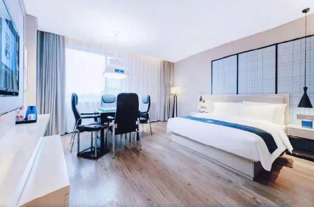 Bed in Echarm Hotel Xiantao Yuantai Weilaicheng