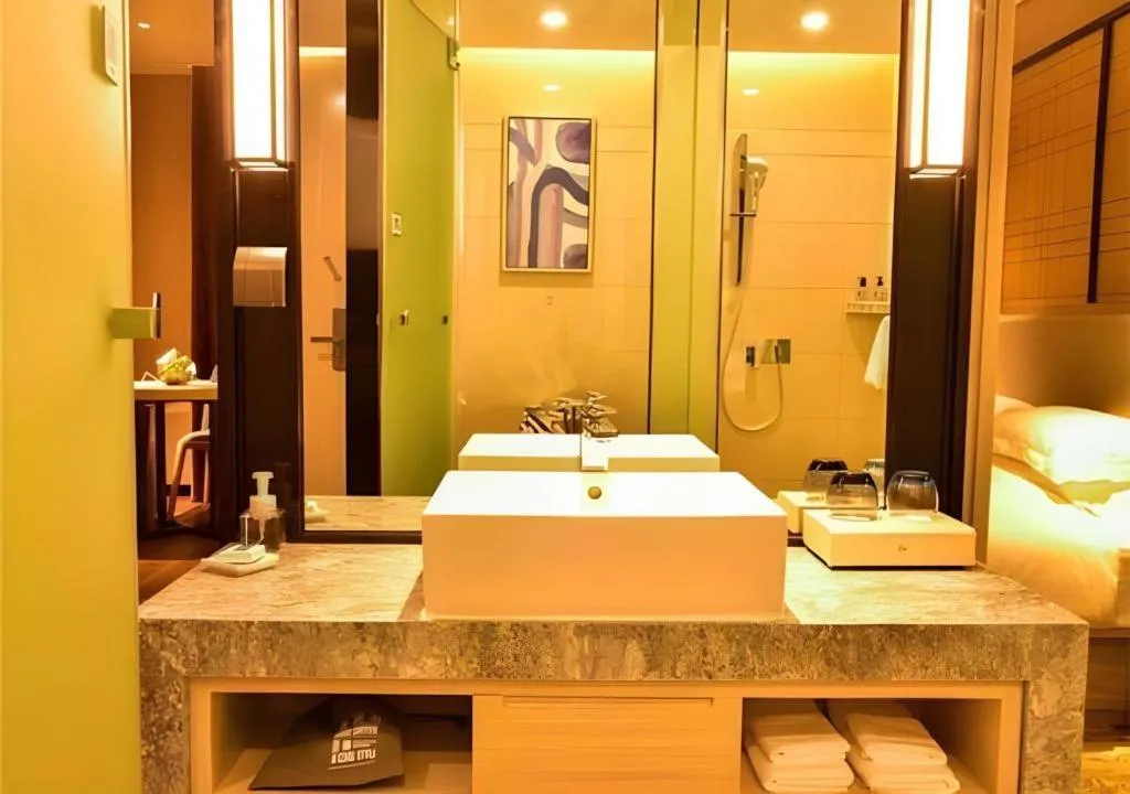 Bed in Echarm Hotel Xiantao Yuantai Weilaicheng