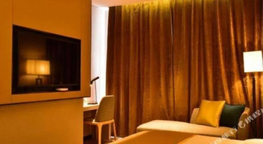 Bed in Echarm Hotel Xiantao Yuantai Weilaicheng