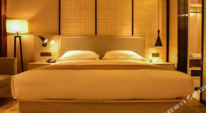 Bed in Echarm Hotel Xiantao Yuantai Weilaicheng