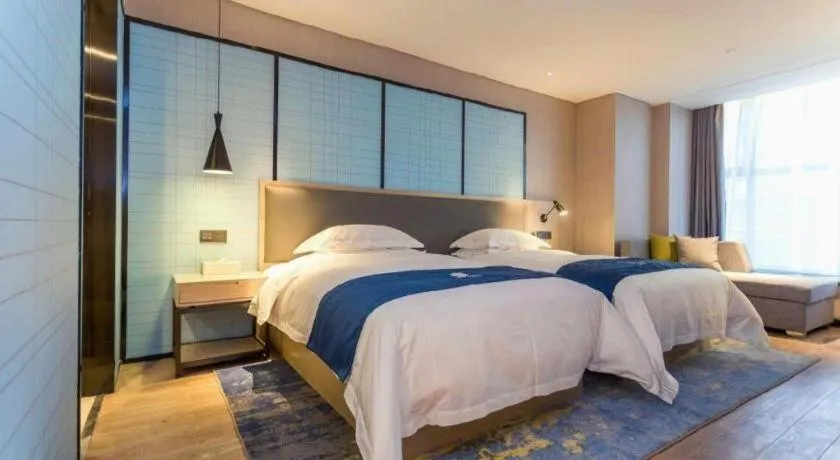 Bed in Echarm Hotel Xiantao Yuantai Weilaicheng