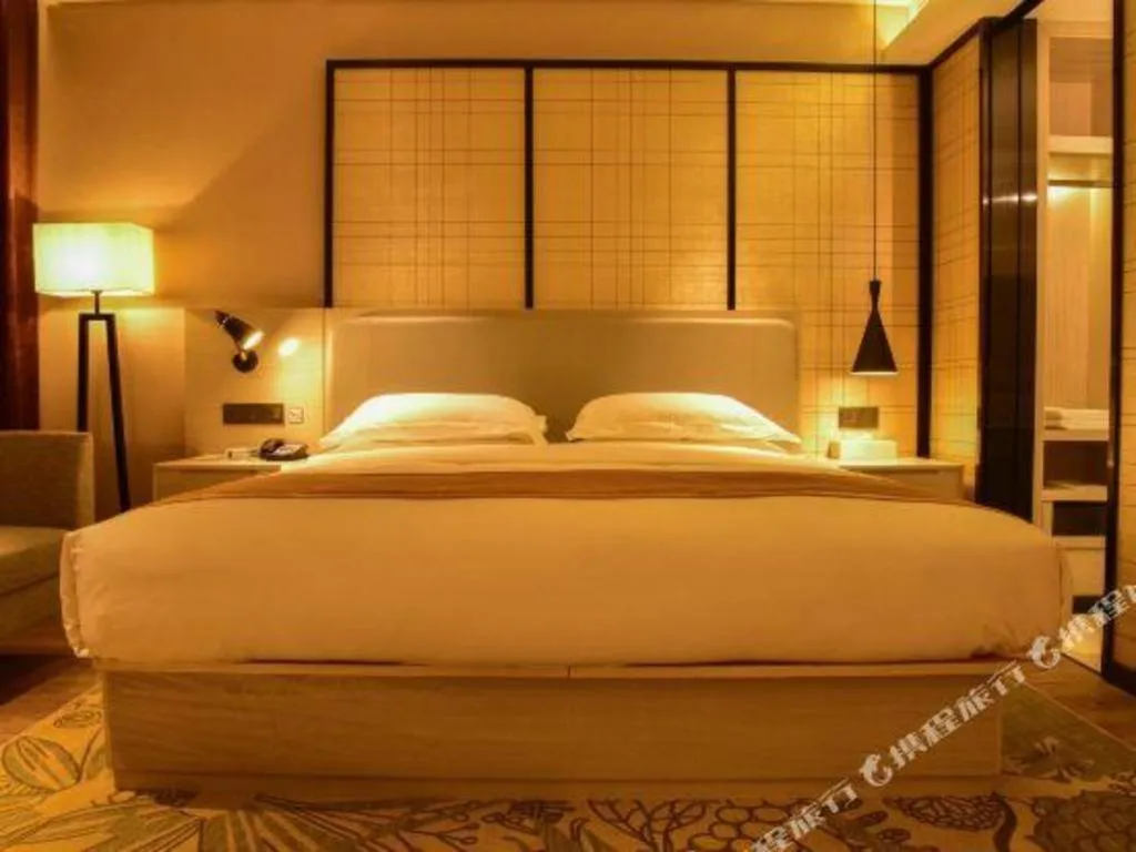 Bed in Echarm Hotel Xiantao Yuantai Weilaicheng