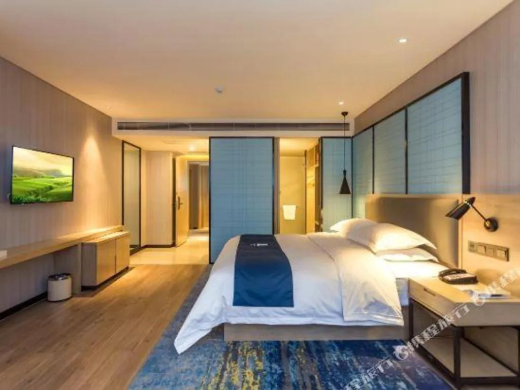 Bed in Echarm Hotel Xiantao Yuantai Weilaicheng