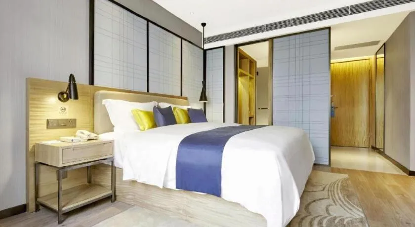 Bed in Echarm Hotel Xiantao Yuantai Weilaicheng