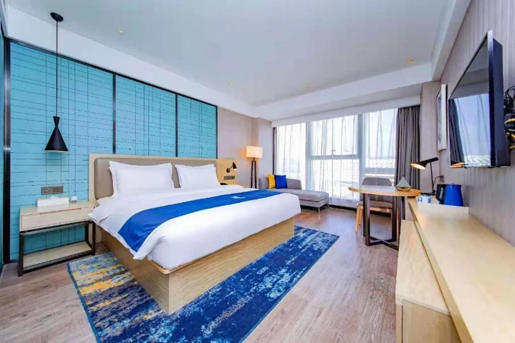 Bed in Echarm Hotel Xiantao Yuantai Weilaicheng