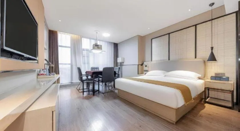 Bed in Echarm Hotel Xiantao Yuantai Weilaicheng