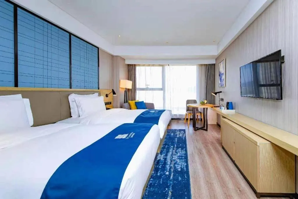 Bed in Echarm Hotel Xiantao Yuantai Weilaicheng