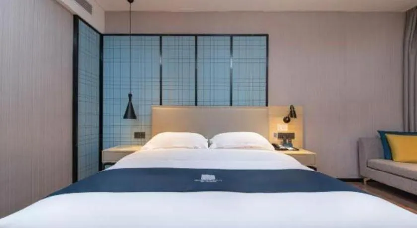 Bed in Echarm Hotel Hefei Binhu Exhibition Center