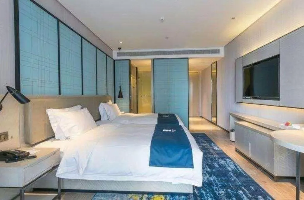 Bed in Echarm Hotel Hefei Binhu Exhibition Center