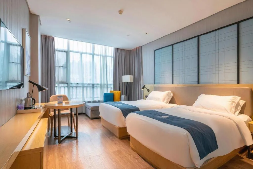 Bed in Echarm Hotel Hefei Binhu Exhibition Center