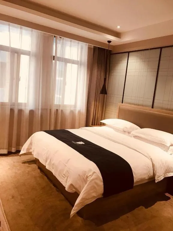 Bed in Echarm Hotel Hefei Binhu Exhibition Center