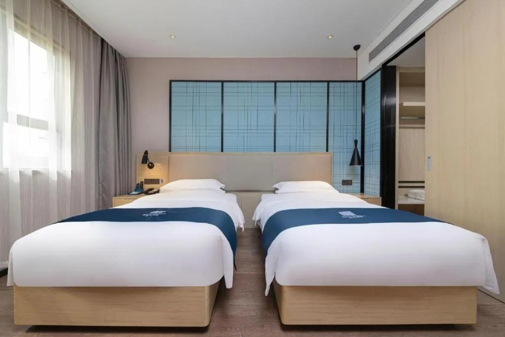 Bed in Echarm Hotel Hefei Binhu Exhibition Center