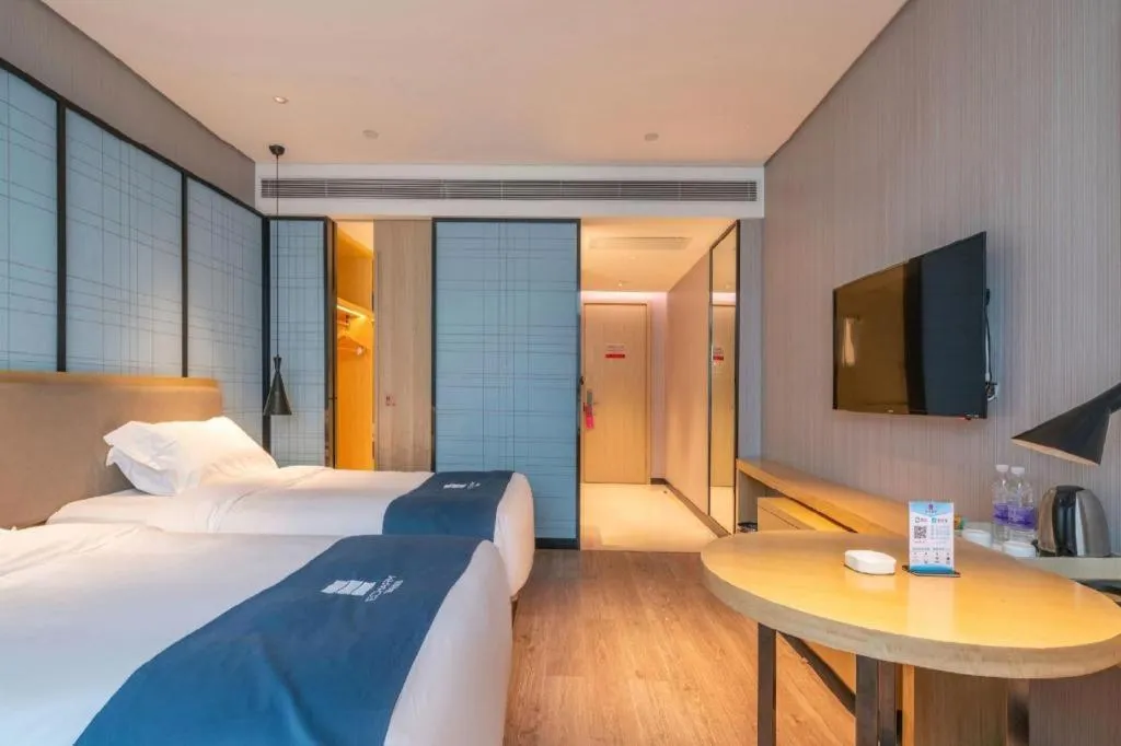 Bed in Echarm Hotel Hefei Binhu Exhibition Center