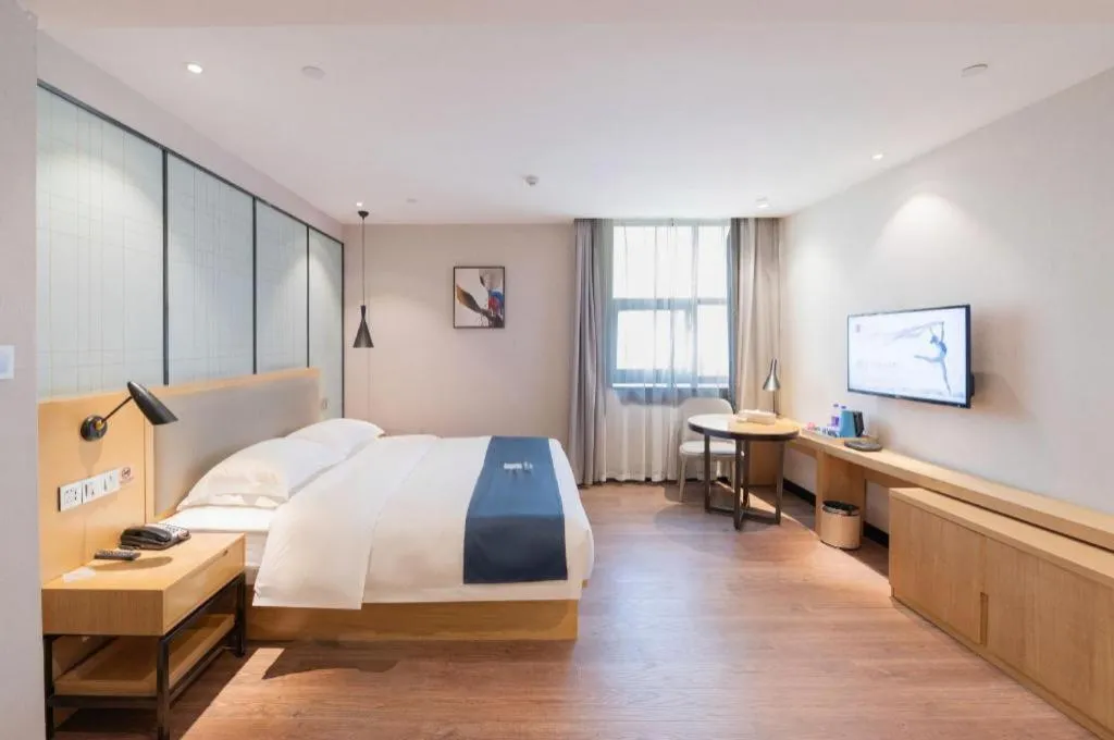 Bed in Echarm Hotel Hefei Binhu Exhibition Center