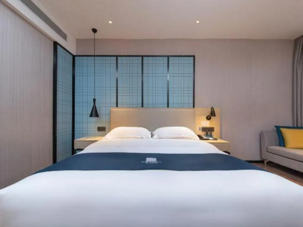 Bed in Echarm Hotel Hefei Binhu Exhibition Center