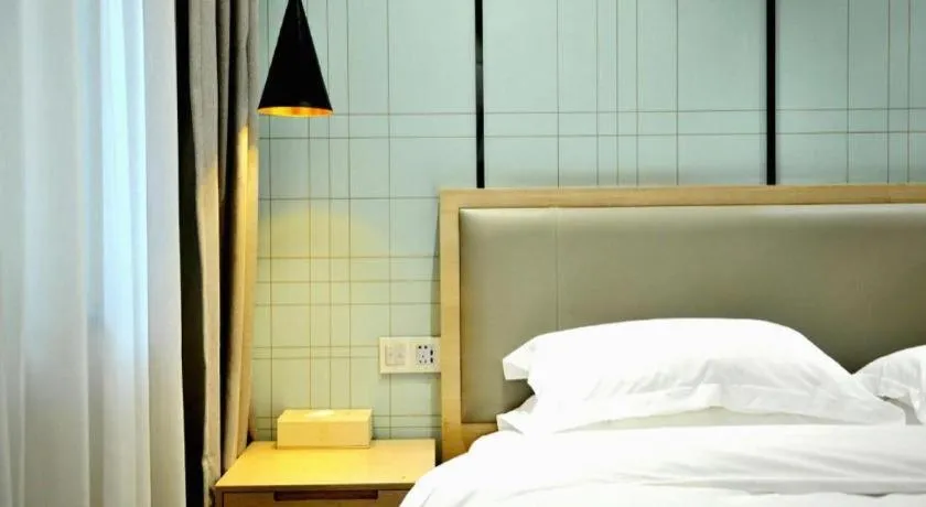 Bed in Echarm Hotel Hefei Binhu Exhibition Center