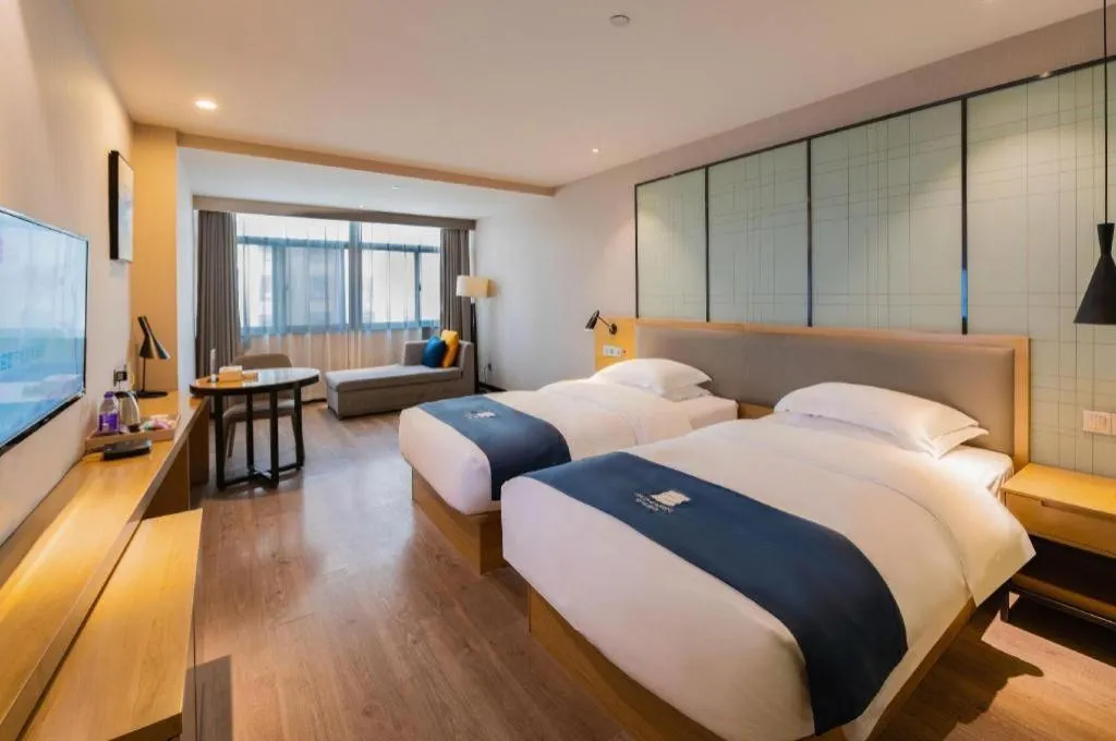 Bed in Echarm Hotel Hefei Binhu Exhibition Center