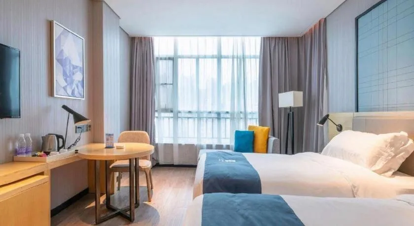 Bed in Echarm Hotel Hefei Binhu Exhibition Center